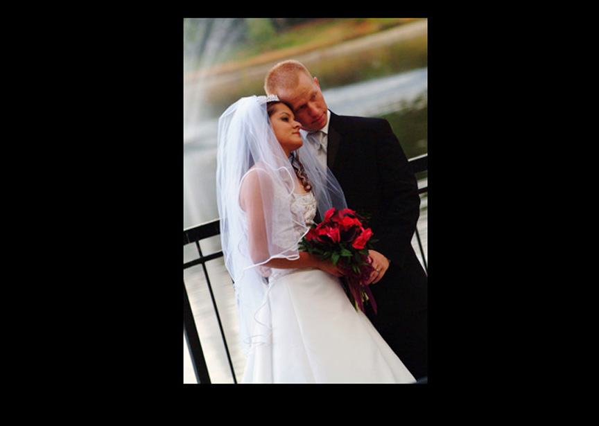 bride and groom by the lake
